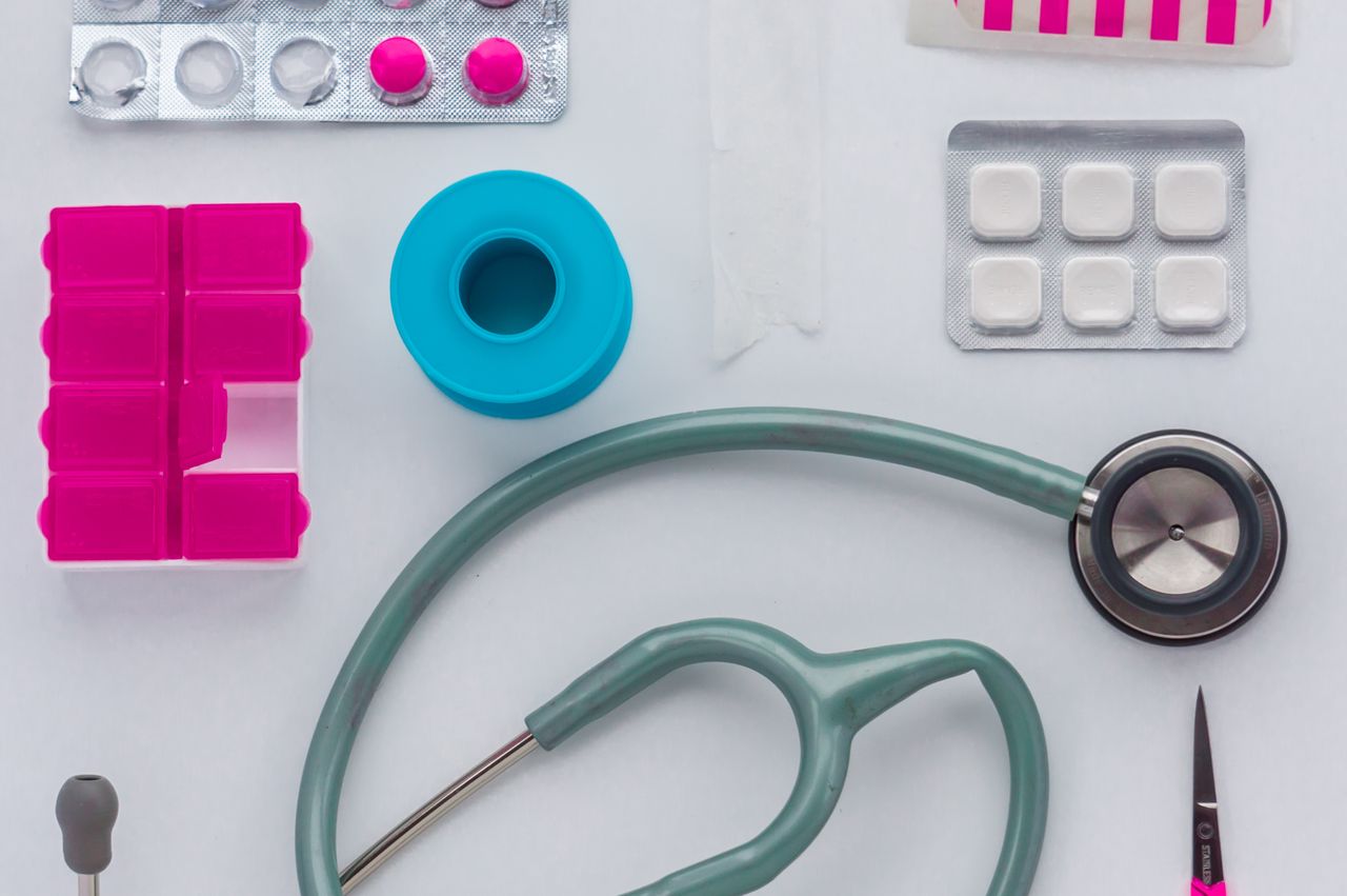 About Top view of medical tools, pills, and equipment arranged on a white background, conveying healthcare essentials.